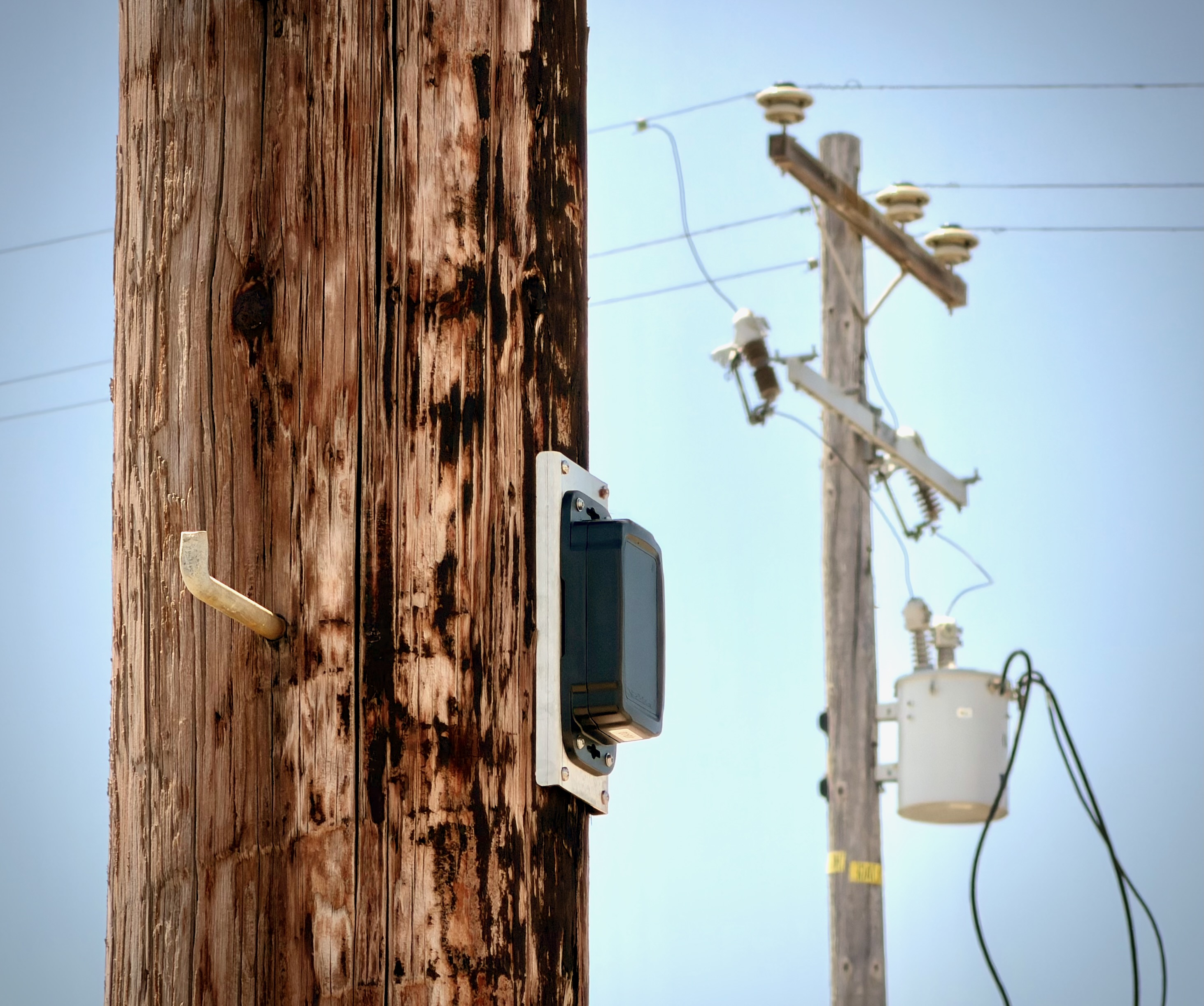 Polebot One installed on a wooden utility pole